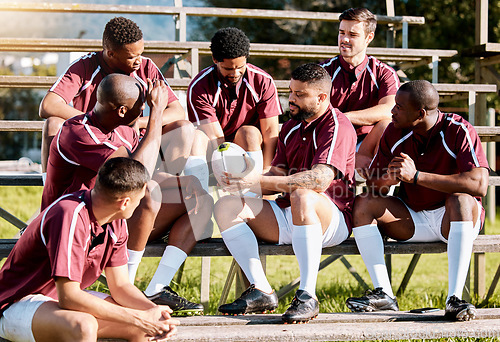 Image of Sports, fitness and rugby team with ball ready for exercise, training and workout for field practice. Depression, teamwork and sad athletes on stadium stand after match, game and competition loss