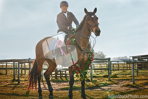 Image of Woman, equestrian winner portrait and pet horse in green countryside and field. Animal, young jockey win an award at competition or show of a rider and athlete with outdoor with sports with horses