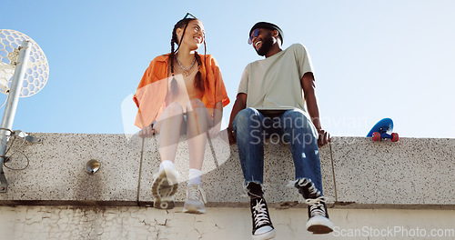 Image of Cool, fashion and joke with young couple hang out on city building together bonding. Interracial stylish young people on a funny city date. Silly, goofy and laughing black man and woman joking