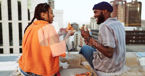 Image of Couple, eating and pizza date on city building rooftop in New York for bonding, trust or love support. Smile, happy or talking woman and black man with fast food in relax tourist location for summer