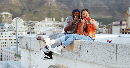 Image of Selfie, city and interracial couple with smile on a wall during holiday in Morocco for adventure. Happy, young and black man and woman with photo on mobile during travel, vacation and summer together