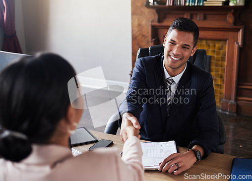 Image of Lawyer man, handshake and client meeting in office of court administration, legal advice and deal. Happy attorney shaking hands in consultation, business success or thank you of negotiation agreement