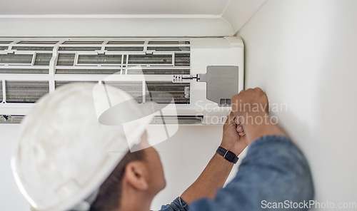 Image of Air conditioner, ac repair and maintenance of a handyman and builder working on home renovation. Electric technician, service worker and contractor in a house for equipment installation on wall