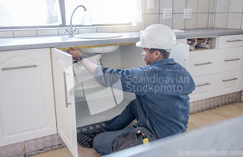 Image of Sink repair, home maintenance and kitchen water pipe check of handyman in a house. Contractor man, builder service and filter improvement installation of a construction employee working in household