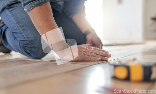 Image of Construction worker hands, wood carpenter and home floor renovation of a builder. Working, woodwork and handcraft of a manufacturing, building and house maintenance development of an artisan