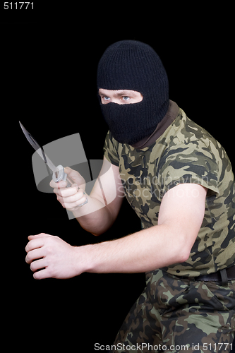 Image of The man with a knife in a black mask