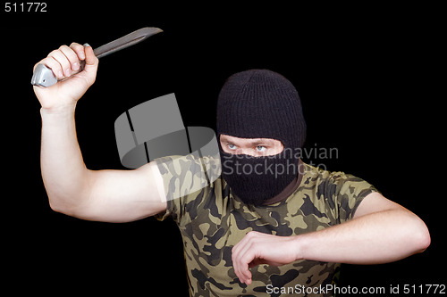 Image of The murderer with a knife in a black mask