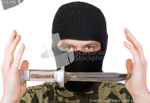 Image of The man with a knife in a black mask. Isolated