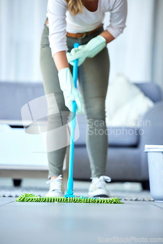 Image of Mop, cleaner and woman cleaning floor with disinfection and hygiene with housekeeping service. Maintenance, professional maid and female housekeeper, fresh clean tiles and bacteria disinfection