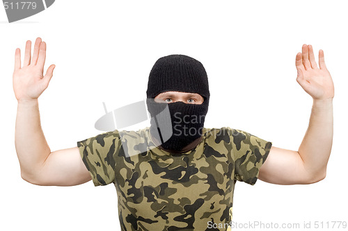 Image of The surrendered criminal in a black mask over white