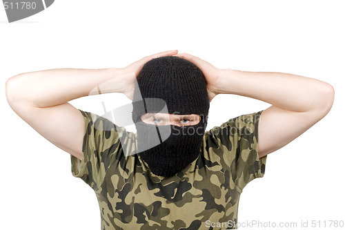 Image of The surrendered terrorist in a black mask over white