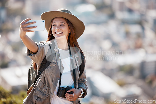 Image of Woman, tourist and smile for travel selfie on hiking adventure, backpacking journey or profile picture in nature. Female hiker smiling for photography, memory photo or scenery in mountain trekking