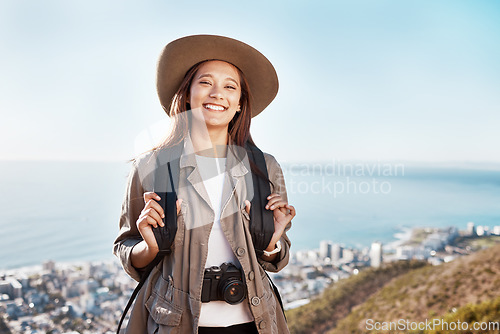 Image of Travel, portrait and woman photographer in nature, happy and relax on adventure on blue sky background. Face, photography and girl student backpacking, sightseeing and on a solo trip in New york