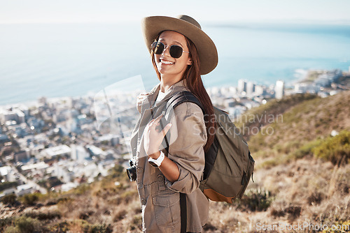 Image of Portrait, hiking and woman with view, fitness and happiness for exercise, fresh air and balance. Face, happy female hiker and lady with sunglasses, nature and freedom on mountain, backpack or explore