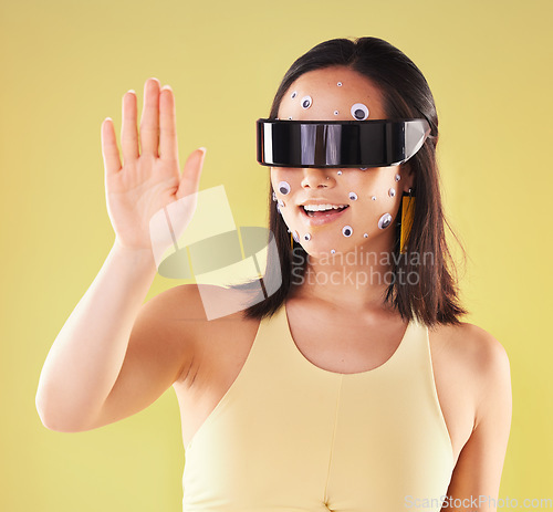 Image of Virtual reality, 3d metaverse and woman in vr, exploring cyber world or futuristic tech. Future, face stickers and happy female with digital headset for gaming in studio isolated on yellow background