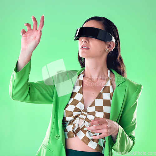 Image of Woman, fashion and cyberpunk with virtual reality glasses, future and connect on studio background. Vr, female and lady with trendy, casual and stylish outfit with eyewear, metaverse and fantasy