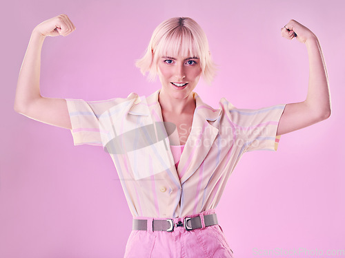 Image of Woman, flexing arm muscle in portrait and smile, power and strong female isolated on pink background. Freedom fight, empowerment and strength with confidence, pride in challenge with champion and win