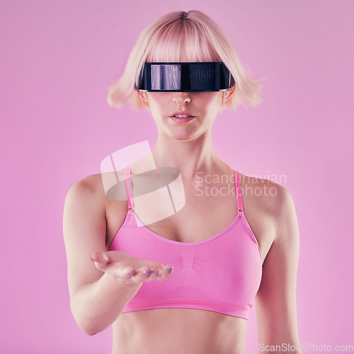 Image of Metaverse, VR glasses and a woman with hand mockup for future scifi 3d gaming technology. Cyberpunk person pink background for digital transformation for cyber world virtual reality product placement