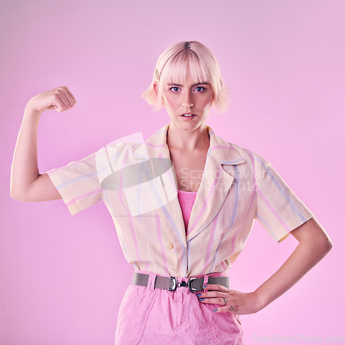 Image of Woman, flexing arm muscle in portrait with power and strong female and fight isolated on pink background. Freedom, empowerment and strength with confidence, challenge with champion and winner