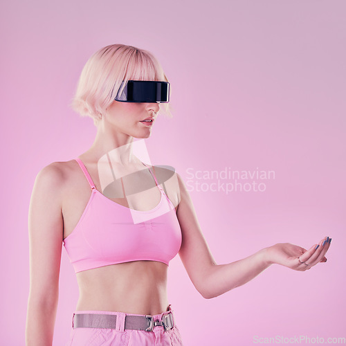 Image of Hand, virtual reality and a woman with mockup for metaverse future scifi and 3d gaming tech. Person on a pink background for cyberpunk and digital transformation for cyber world ai product placement