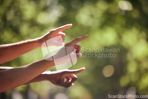 Image of Pointing, gesture and hands in nature for bird watching, hiking and view. Summer, travel and fingers gesturing for a location, adventure and showing while walking in a park for fitness and cardio