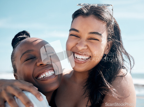 Image of Woman, friends and hug with smile for beach day, summer vacation or travel together outdoors. Portrait of happy women laughing in joy for friendship, travel or fun holiday bonding by the ocean coast