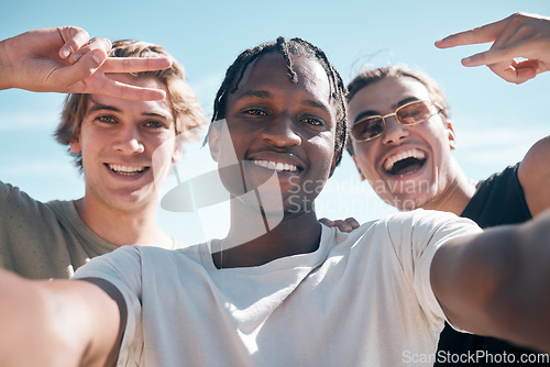 Image of Selfie, diversity and portrait of male friends on a summer vacation, weekend trip or adventure. Happy, sky and multiracial men with a smile taking picture with hand gestures while on holiday together