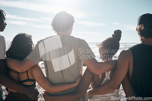 Image of People, back or standing hug by beach, ocean or sea in social gathering, group vacation or relax summer holiday. Men, women or diversity friends in embrace, travel bonding or nature community support