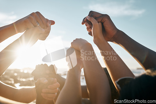 Image of Friends, bonding and holding hands on beach social gathering, community trust support or summer holiday success. Men, women and diversity people in solidarity, team building or travel mission goals