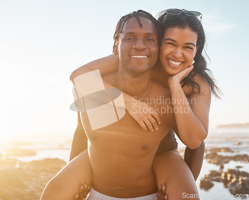 Image of Fun couple, portrait or piggyback on sunset beach, ocean or sea in energy holiday, love vacation or summer travel. Smile, happy or man carrying black woman in bonding games, freedom trust or support