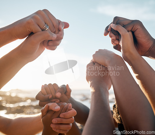 Image of People, bonding and holding hands on beach social gathering, community trust support or summer holiday success. Men, women and diversity friends in solidarity, team building or travel mission goals