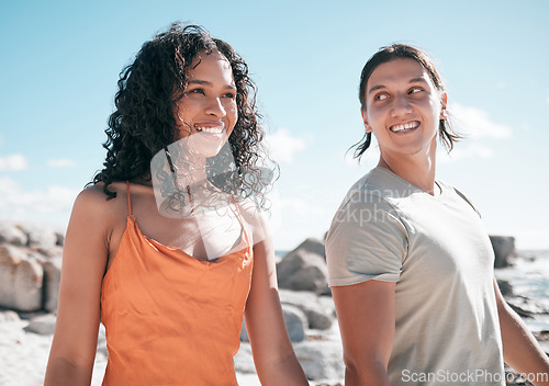 Image of Love, happy and couple at the beach for travel, fun and walking against blue sky background. Smile, affection and cheerful woman with man on vacation, relax and bond on summer trip together in Miami
