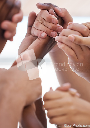 Image of Praying, hand and people worship for peace, love and trust in God against blurred background. Church, christian and community group holding hands in prayer, faith or praise, belief and unity in Jesus
