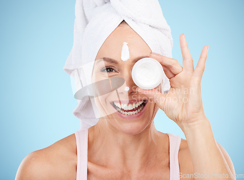 Image of Lotion, jar and beauty portrait of woman for face, smile or cosmetics on mockup blue background. Facial cream, skincare and model with container of sunscreen, wellness or advertising aesthetic makeup