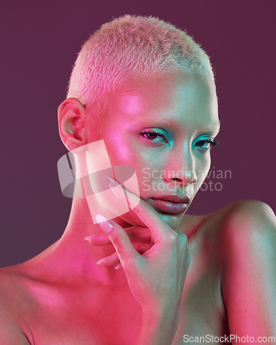 Image of Art, beauty and portrait woman with neon makeup and lights for creative advertising on studio background. Cyberpunk, gen z face of girl and model isolated for skin care and futuristic mock up space.