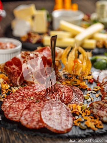 Image of Cutting sausage and cured meat