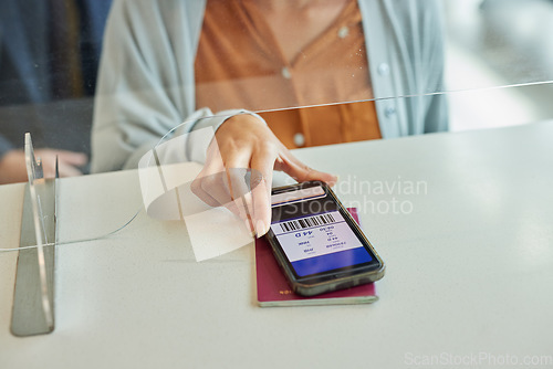 Image of Hands, phone and passport with digital ticket at airport for travel, immigration or transport service on table. Hand of traveler showing smartphone boarding pass, barcode or permit on mobile app