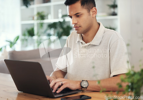 Image of Serious, planning and young man on laptop typing email, financial management or startup investment research. Professional worker, employee or person working on computer for finance career opportunity