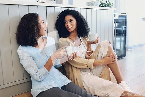 Image of Coffee, mother and adult daughter on floor, love and conversation for quality time, loving and bonding. Family with gossip, mama or female drinking tea, ground or discussion on break, relax or advice