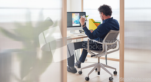 Image of Magazine, planning or graphic designer man on computer for creative research, web page strategy or branding. Startup, office or employee at desk working on project for marketing or advertising blog