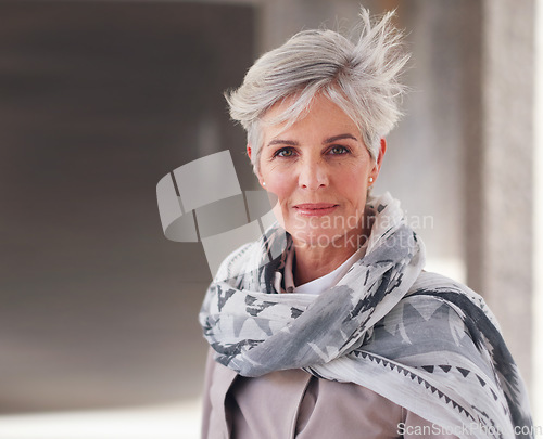 Image of Portrait, travel and mature woman tourist with fashion or style in an urban town or city on vacation or holiday. Adventure, serious and face of elderly female on retirement traveling with mockup