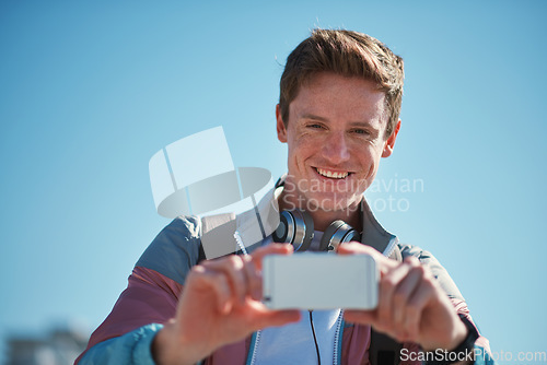 Image of Young man with smartphone, photography outdoor with technology, photographer or content creator with smile. Travel blog, summer and taking picture with happy person, creative with adventure in Sydney