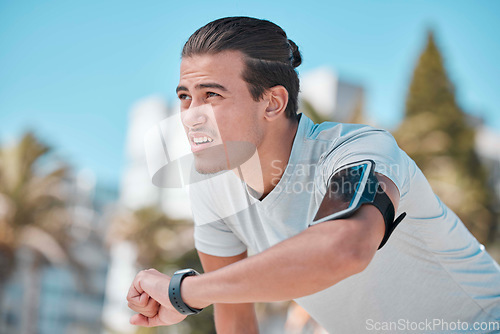 Image of Smart watch, outdoor workout and man tired from exercise, fitness and running. Stopwatch time, sports person and breathing for heart rate, marathon progress goals or monitor wellness on data app gear