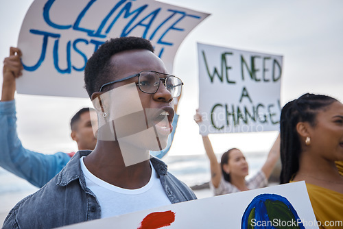 Image of Climate change, sign and black man profile with megaphone for freedom movement. Angry, crowd screaming and young people by the sea with world support for global, social and equality action at ocean