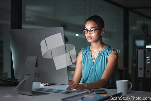 Image of Computer reading, focus and African woman editing article for social media app, website or online web blog. Employee typing, late night research review and overtime journalist working on news post