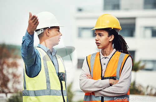 Image of Supervisor, engineering and angry with people on construction site for project management, building and mistake. Designer, stress and architecture with contractor shouting for review and frustrated