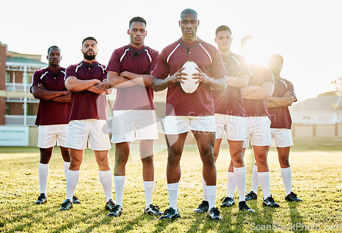 Image of Rugby, grass and portrait of men, team with ball and standing together with confidence for winning game. Diversity, black man and group of strong sports people in leadership, fitness and teamwork.