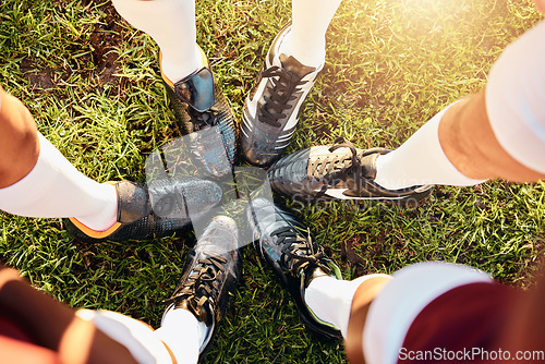 Image of Shoes, huddle and team on grass field above for sports motivation, coordination or collaboration outdoors. Feet and legs of group in sport circle, fitness training or planning strategy ready for game