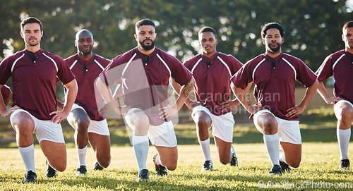 Image of Rugby, racial activism or team take a knee in solidarity or support for a match, game or sports match. Men, fitness or group of male athletes in unity against inequality or global racism on grass