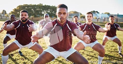 Image of Rugby, haka or team with motivation, solidarity or support in a battle cry, war dance or challenge with unity. Performance, fitness group or athletes dancing before a game or match on a grass stadium